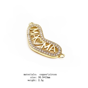 Macro view of gold-plated MAMA heart connector with cubic zirconia for DIY jewelry
