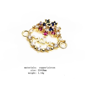 Detail view of MAMA connector with colorful zircon pavé and 18K gold plated finish