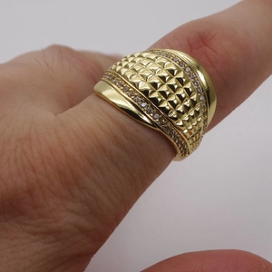 Macro shot of 14k gold plated wide ring with geometric patterns and micro-inlaid zircons