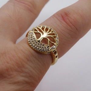 Detail of life tree ring with zircon inlay and heart-shaped hollows on the gold band