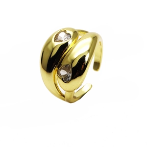 Detail of 14k gold plated wide ring with double heart-shaped cubic zirconia inlay