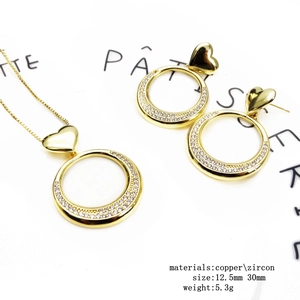 Gold-plated copper necklace and earrings set with zircon heart and hoop charms