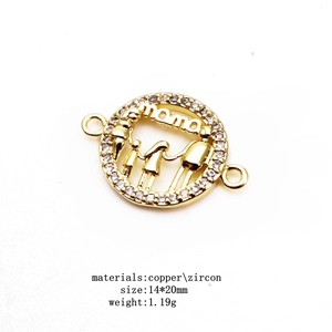 Macro detail of MAMA zircon bracelet connector with family silhouette in gold plating