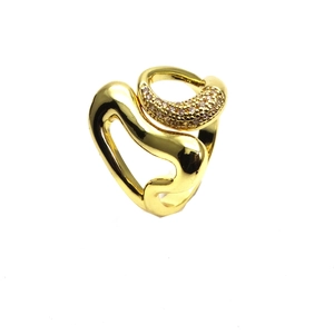 Detail view of gold-plated 14k ring featuring irregular wavy lines and micro-pave zircons