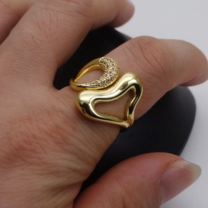 14k gold plated heart ring with micro zircon inlay shown on hand with adjustable band
