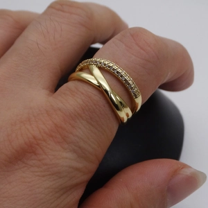 Macro detail of 14k gold plated double-layer ring with sparkling pave cubic zirconia