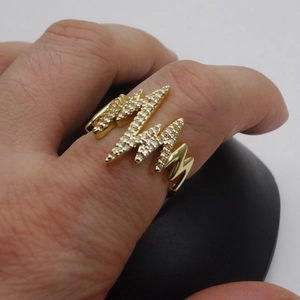 Detail of 14k gold plated lightning bolt ring with micro-pave cubic zirconia on hand