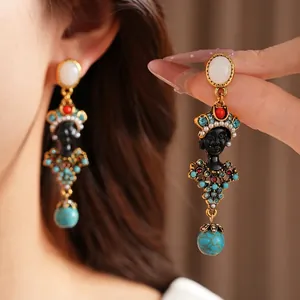 Ornate vintage resin portrait drop earrings with rhinestones and turquoise beads