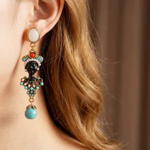 Vintage resin portrait drop earrings featuring colorful rhinestones and turquoise bead drop