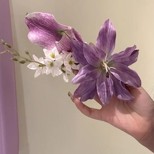 Detailed view of elegant purple lily flower hair clip accessory for Hanfu styling