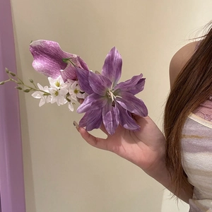 Detailed shot of an elegant purple lily flower hair clip for Chinese style hairstyles