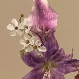 Macro view of elegant purple and white silk flower hair clip for traditional hair styling