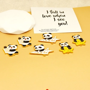 Detailed view of cute panda alloy enamel charms with star and paper plane designs