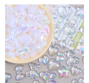 Iridescent aurora resin charms in heart and bear shapes for creative DIY craft making