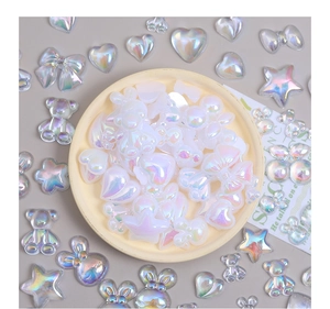 Mix of iridescent white resin charms in star, heart and bear shapes for DIY crafts