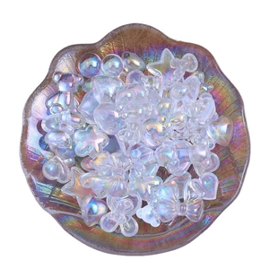 Iridescent cartoon bear and star resin charms for DIY craft in a shell tray