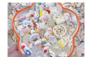 Macro shot of colorful resin cartoon charms and Miffy motifs in a decorative bowl