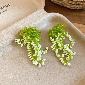 Exquisite green and white beaded flower tassel earrings with silver needle hooks