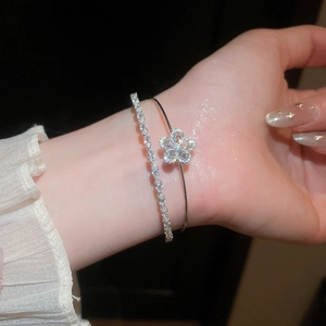 Elegant silver-tone double-layer bracelet featuring a zircon flower and marquise-cut stones.