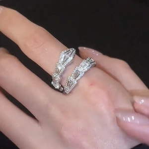 Close-up detail of a silver snake-shaped ring encrusted with glittering white zircons