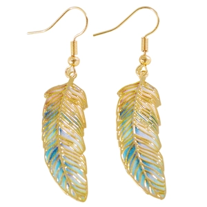 Detailed view of colorful enamel feather earrings with golden hooks and intricate texture