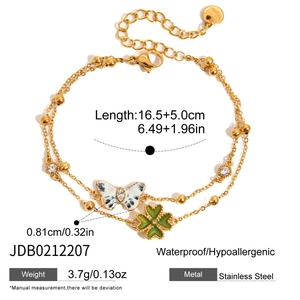Elegant double-layer gold stainless steel bracelet with butterfly and clover charms.