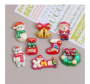Flat lay of colorful Christmas resin charms with pearlescent finish for DIY crafts