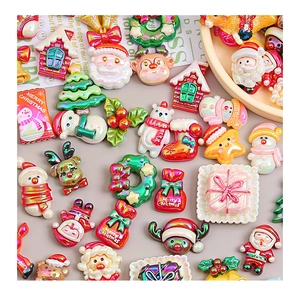 Macro shot of assorted Christmas resin charms with pearlescent finish for DIY crafts