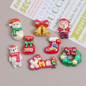 Colorful resin Christmas charms for DIY crafts featuring snowman and Santa designs