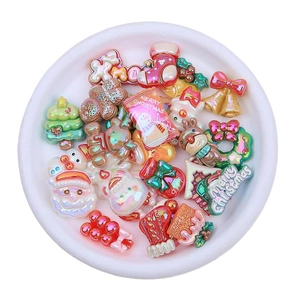 Mix of iridescent resin Christmas charms including Santa, trees, and reindeer for DIY crafts