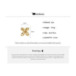 Detailed specifications of gold oversized metal flower earrings with size and weight.