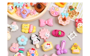 Macro shot of assorted colorful cartoon resin charms for creative DIY jewelry making