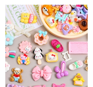 Close-up of colorful Sanrio resin charms for DIY cream glue crafts and hair accessories