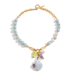Seaside holiday necklace with ceramic shell beads and pearls on gold titanium chain