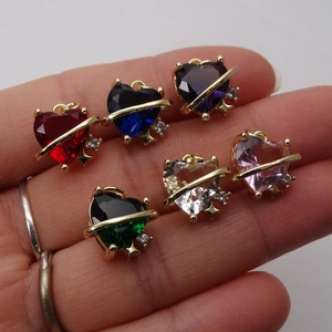 Saturn-style heart crystal pendants with gold accents in six vibrant colors