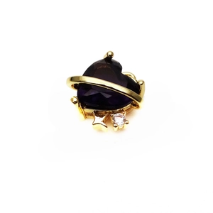 Detailed shot of purple heart crystal pendant with golden orbital ring and small zircon