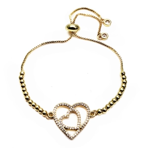 Detail of adjustable gold bracelet featuring interlocking hearts set with cubic zirconia