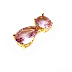 Pink water-drop and oval gemstone cat-themed pendant with gold claw setting for jewelry