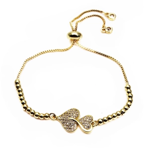 Detail of adjustable heart bracelet with pavé cubic zirconia and gold slide closure