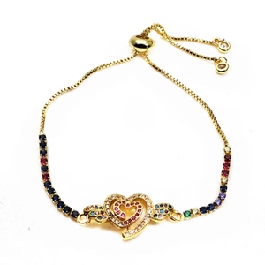 Close-up of golden adjustable heart bracelet with multicolored micro-pave crystals