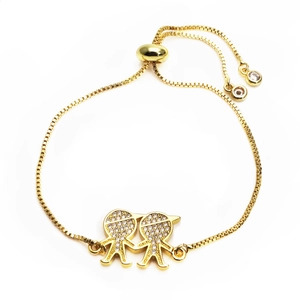 Detail of gold-plated adjustable bracelet with pavé zircon boy and girl charms