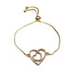 Close-up of golden adjustable heart bracelet featuring micro-paved cubic zirconia stones
