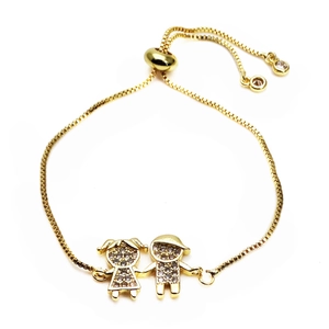 Detailed view of adjustable gold boy and girl pendant bracelet with pavé cubic zirconia