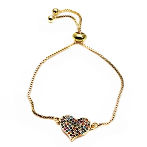 Close-up of golden heart bracelet with colorful cubic zirconia and adjustable slide clasp