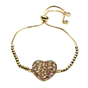 Adjustable gold heart bracelet with colorful cubic zirconia stones on white background