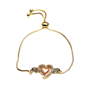 Adjustable gold heart bracelet with zircon stones and colorful wing accents on white background