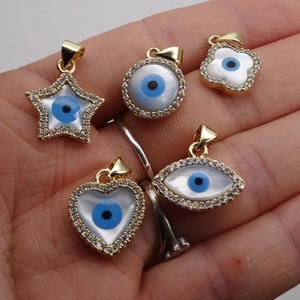 Gold-plated evil eye charms set with shell inlay and micro-pave zircons in five shapes