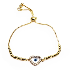 Detailed macro view of gold-plated evil eye heart bracelet with adjustable sliding buckle