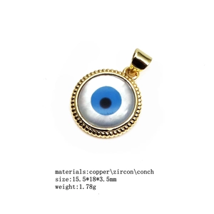 Detail of evil eye pendant with micro-set zircon and shell, size 15.5x18x3.5mm