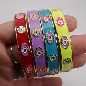 Bohemian evil eye and Hamsa hand gold-plated open cuff bracelets in four vibrant colors